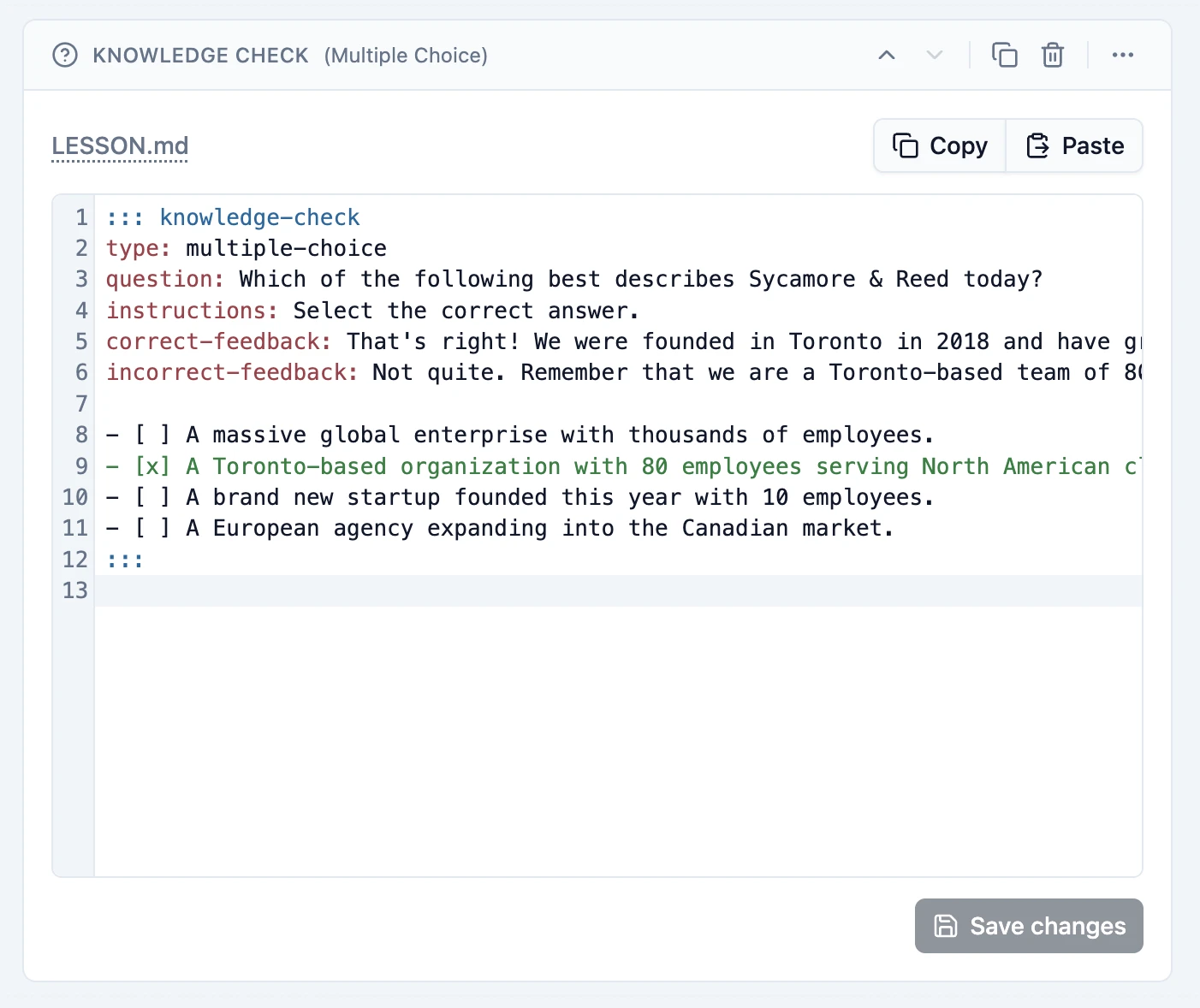 A multiple-choice Knowledge Check block in Slate's editable LESSON.md view, showing the question, feedback, answer options, and Copy, Paste, and Save changes controls.